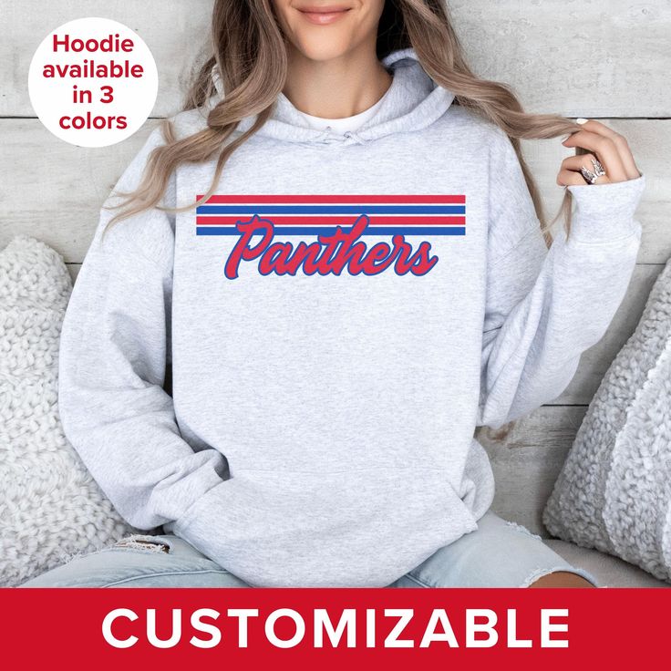 Gear up for game day with this retro-inspired sweatshirt featuring your favorite team mascot customized in the colors of your choice. These designs are intended to have a vintage look; colors are not as vibrant as what you see on your screen. ** SWEATSHIRT FEATURES ** This unisex heavy blend hooded sweatshirt is made with a thick blend of cotton and polyester and is created for comfort. Soft and warm, it's a perfect choice for any cold day. In the front, the spacious kangaroo pocket adds daily p Team-colored Hoodie With Team Logo For Fans, Team-colored Hoodie With Team Logo For Sports Season, Sports Season Team-colored Hoodie With Team Logo, Pre-shrunk School Spirit Hoodie For Sports Season, Game Day Team Spirit Hooded Top, Cotton Team Spirit Hoodie For Fan Merchandise, Team-colored Hooded Sweatshirt For Fans, Team-colored Hooded Top For Game Day, Team-colored Hoodie With Team Logo For Game Day