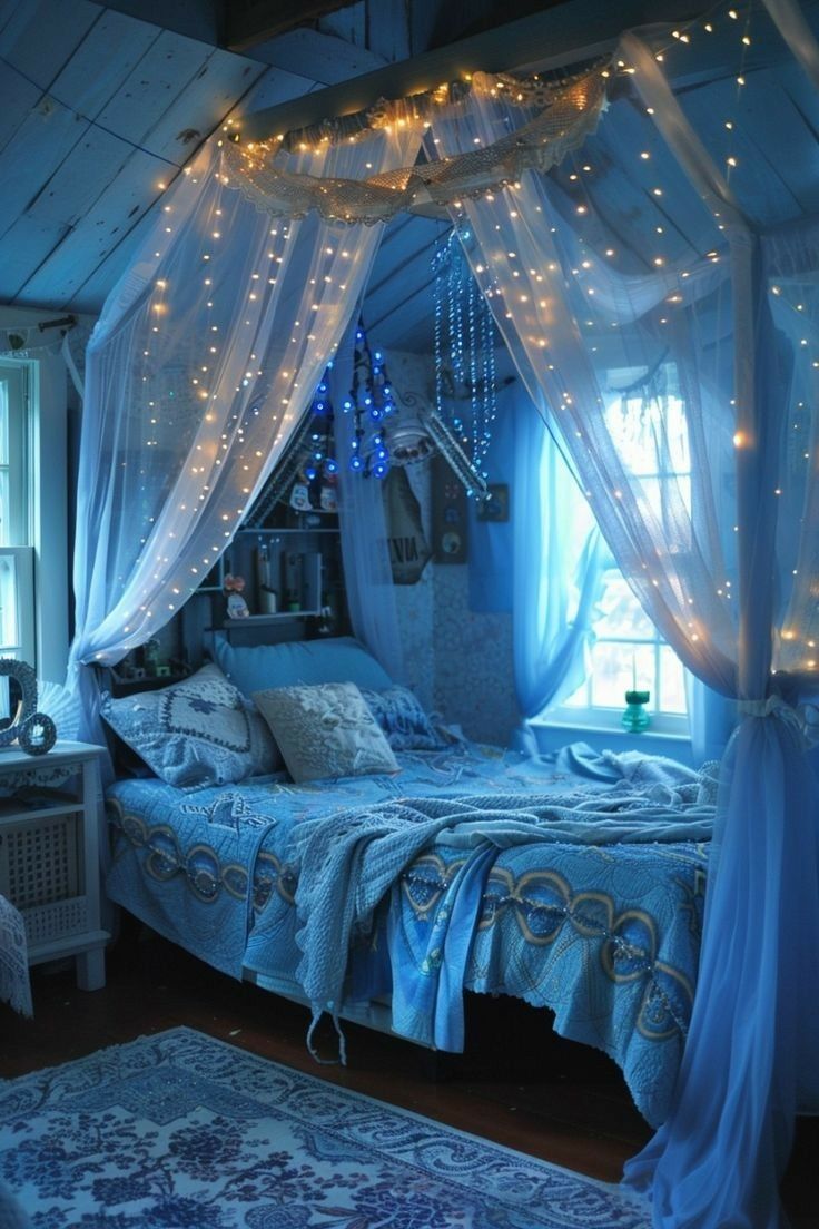 a bed room with a neatly made bed and lights on the ceiling over it's headboard