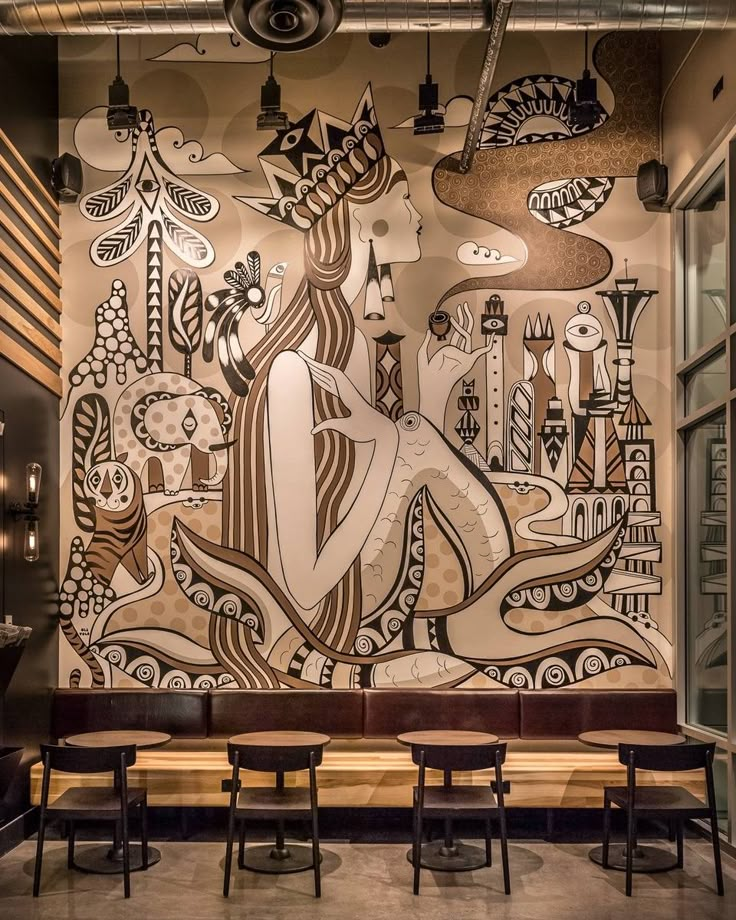 an artistic mural on the wall of a restaurant