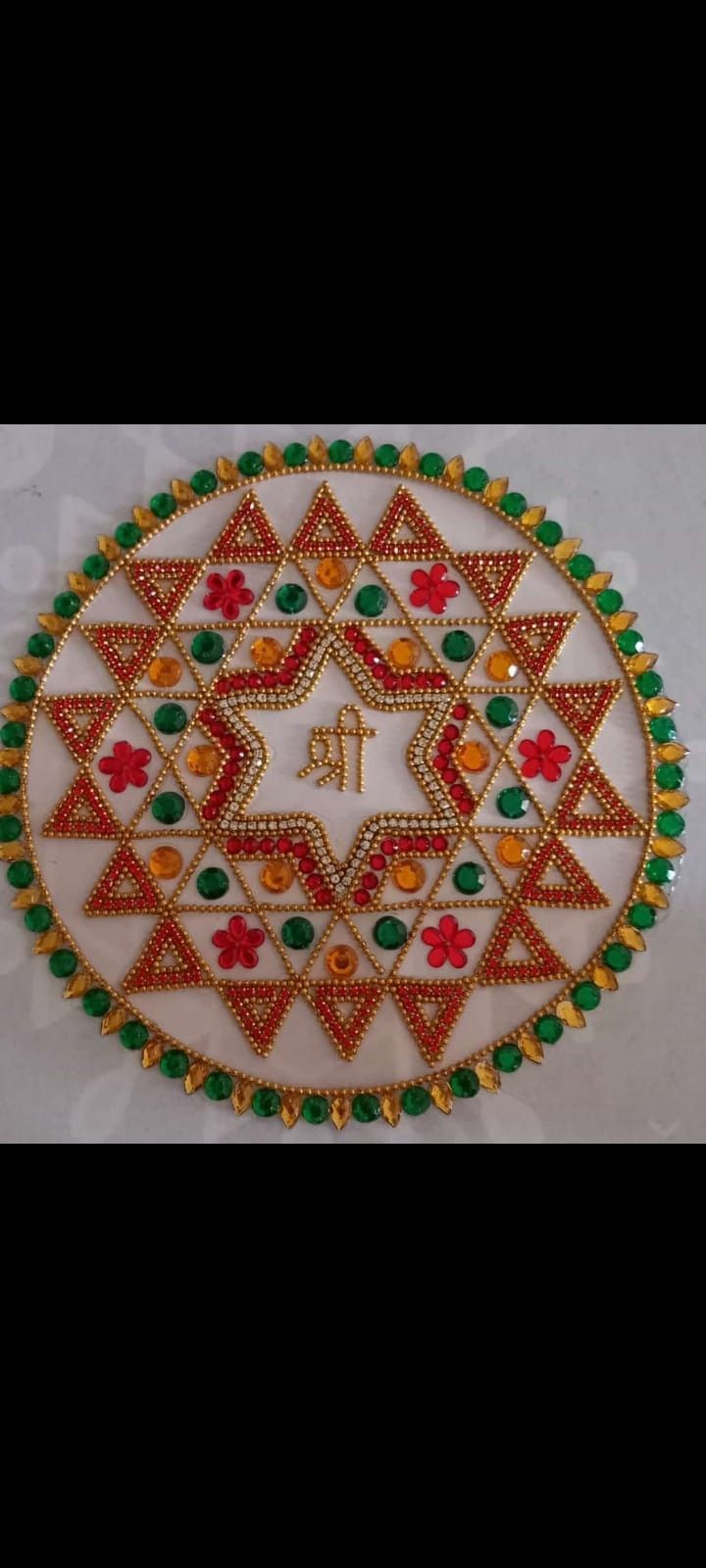 an intricately decorated plate with the letter t on it