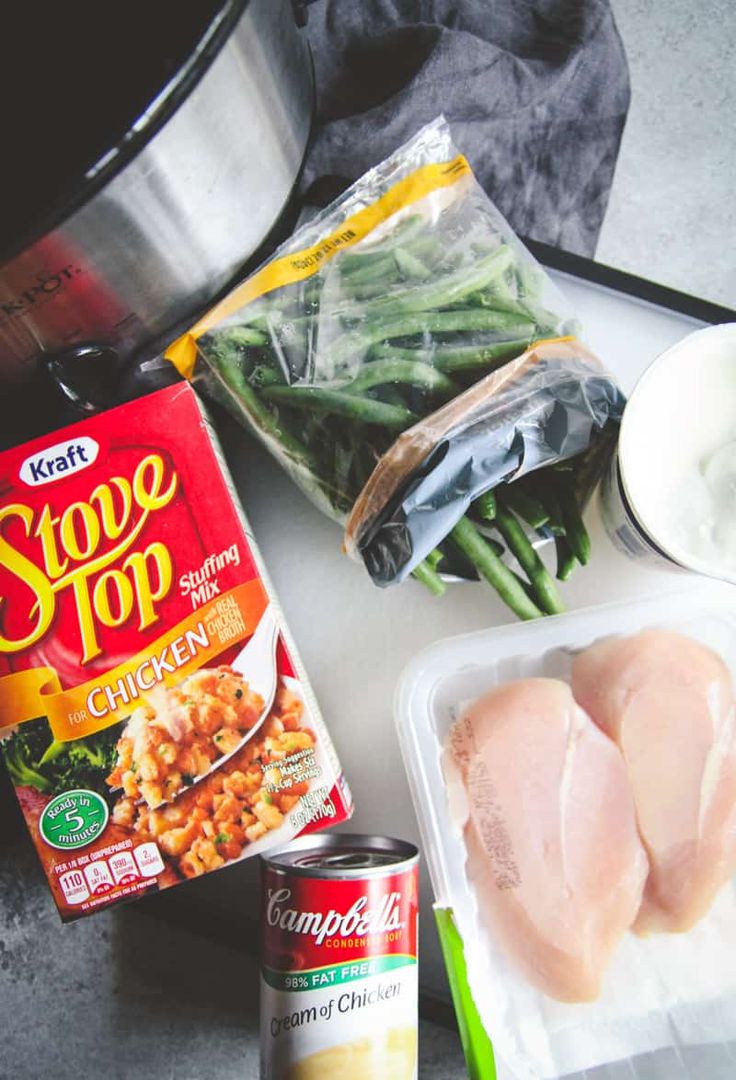 ingredients to make chicken and rice soup laid out on a counter