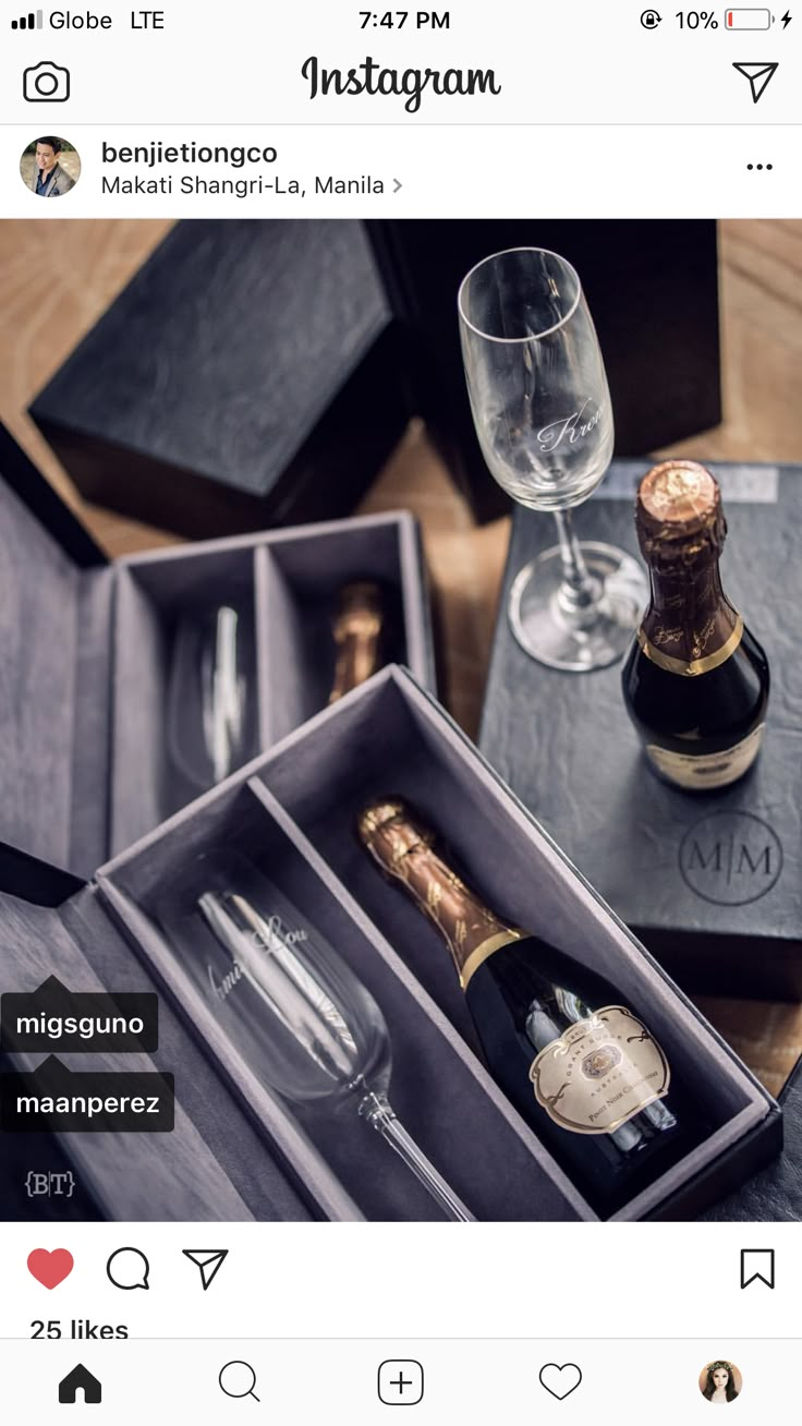 an instagram with two bottles of champagne and wine glasses