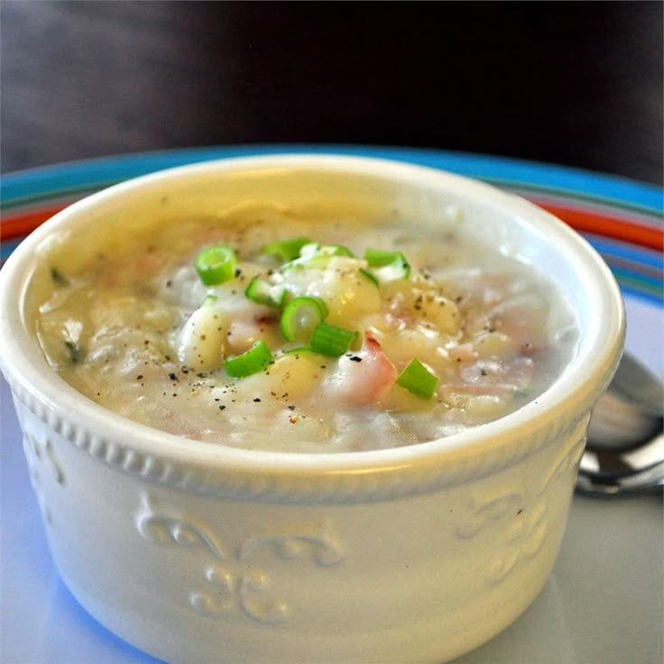 a white bowl filled with soup on top of a table