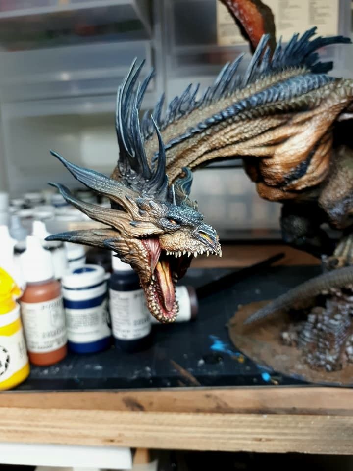 a statue of a dragon with its mouth open