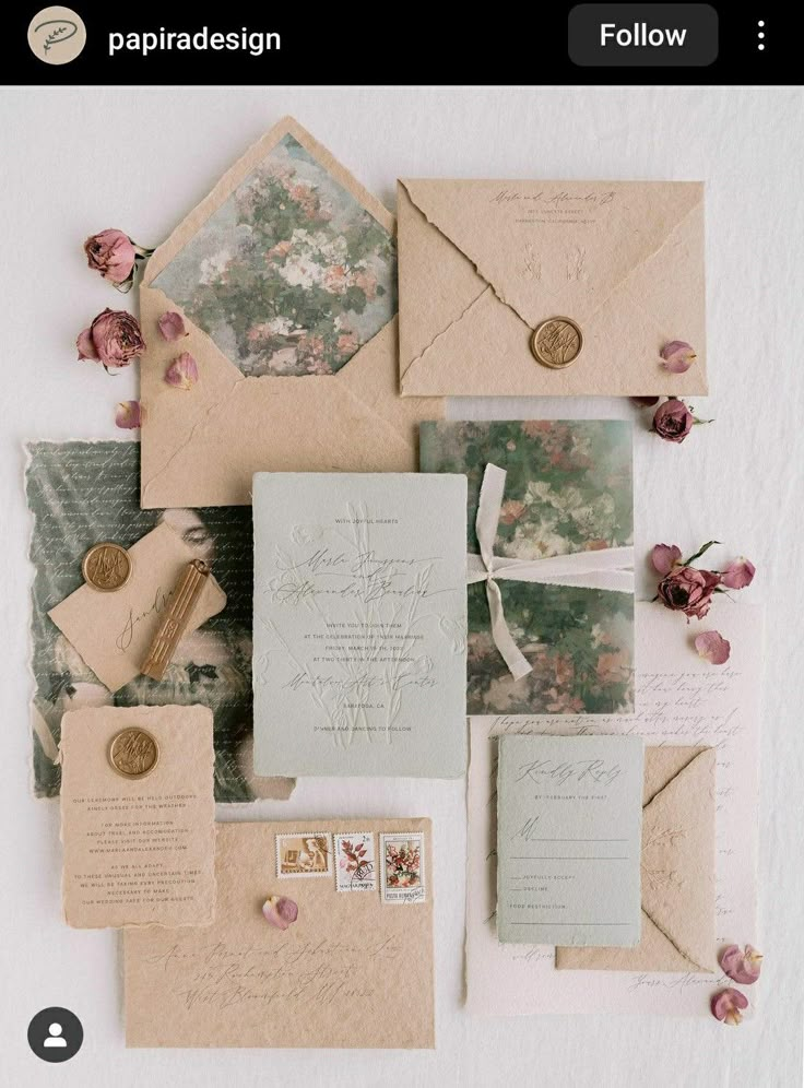 the wedding stationery is laid out on top of each other, including envelopes and cards