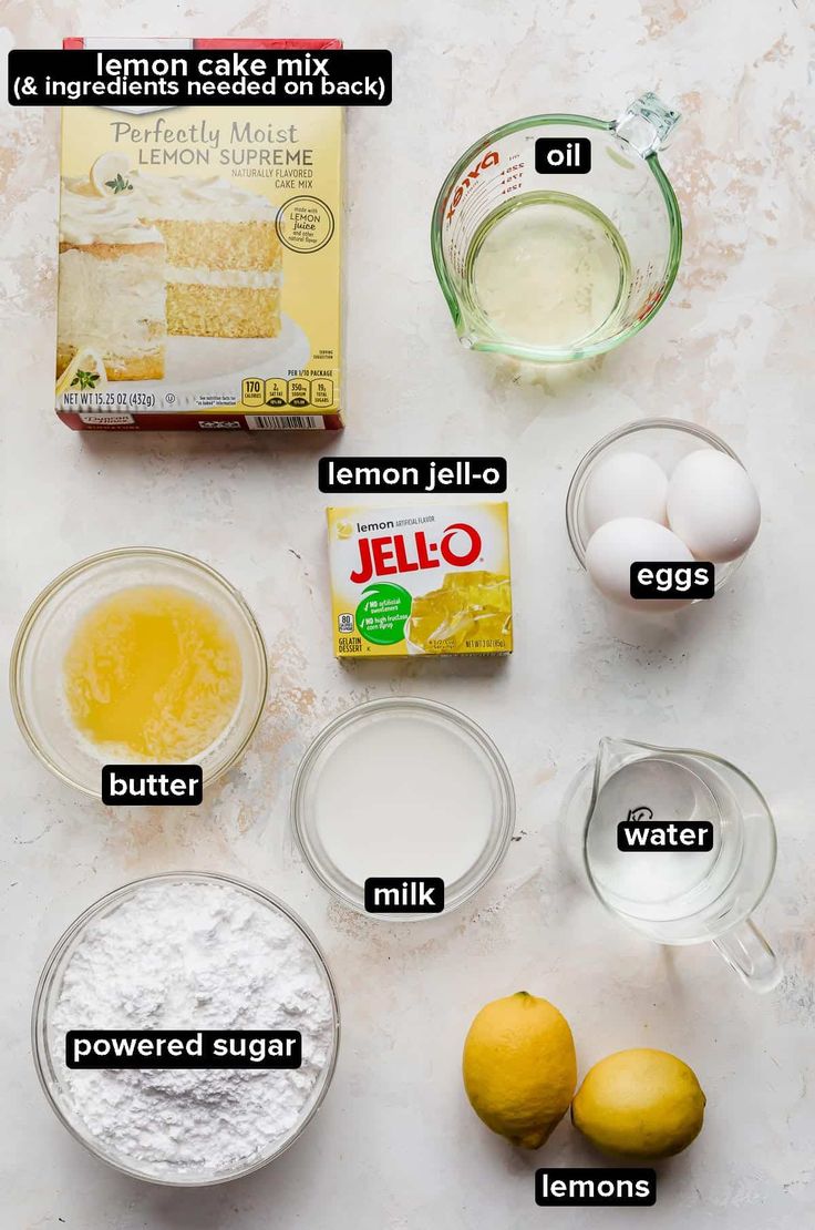 ingredients to make lemon cake laid out on a table