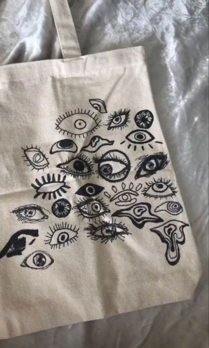 a white bag with an eye design on it