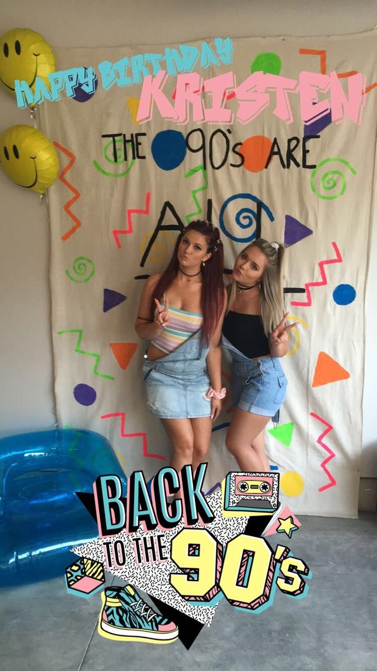 two girls are standing in front of a backdrop that says back to the 90's