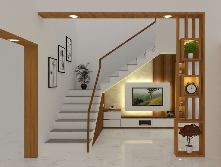 a living room with stairs leading up to the second floor and a painting on the wall