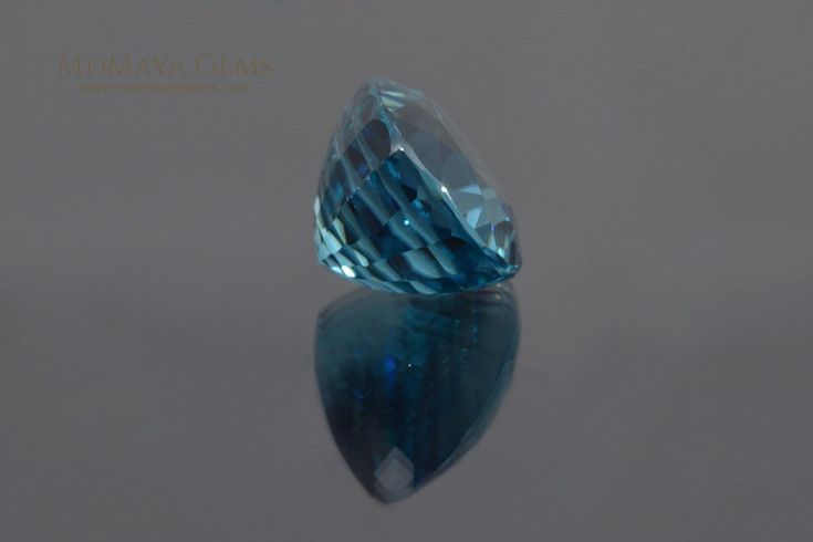 split Natural Cambodian Blue Zircon. Oval Cut. 9.50 ct. This large blue gemstone is ideal for your custom jewelry. In 1952, the Jewelers of America organisation added the Zircon to the list of birthstones for the month of December. It is believed that the Zircon attracts prosperity. The name for the Zircon stone seems to derive from the word "zargoon" which in Arabic means "vermilion" (cinnabar powder used to obtain deep red paint) and in Persian means "golden color". In the 18th century, the co Gia Certified Oval Aquamarine Jewelry, Blue Round Cut Gemstones For Formal Occasions, Formal Blue Round Cut Gemstones, Blue Oval Faceted Gemstones, Blue Faceted Oval Gemstones, Faceted Blue Oval Gemstones, Blue Faceted Gemstones For Anniversary, Classic Blue Round Cut Gemstones, Classic Blue Oval Gemstones