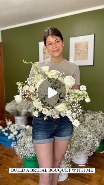 a woman holding a bouquet of flowers in front of her face with the words build a bridal bouquet with me