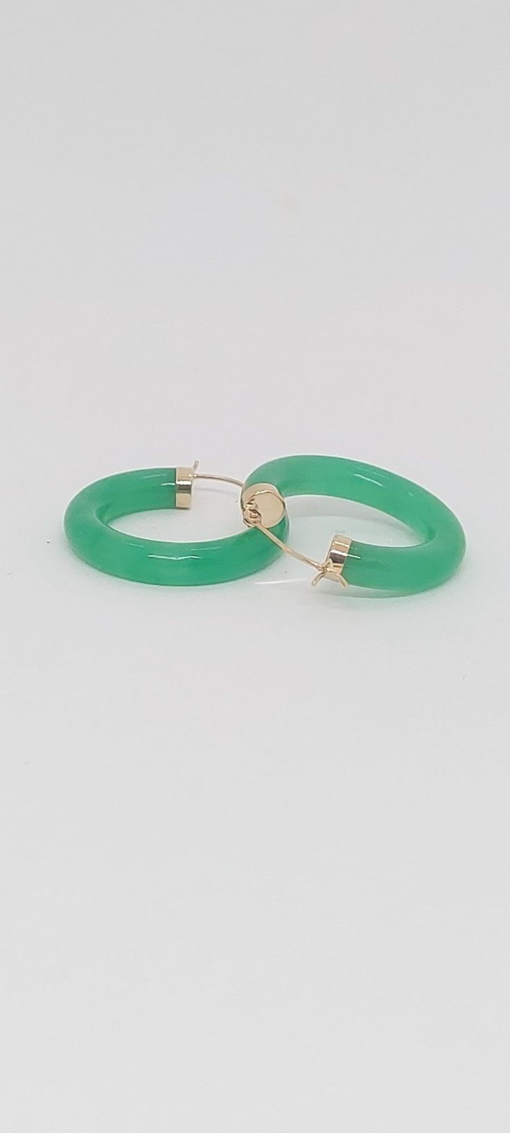 GREEN Jade Hoop Earrings in 14K Yellow Gold. 24 millimeters. Green Jade 14k Yellow Gold Hoop Earring. JADE Lover. Product Info: -Earring diameter: 24 millimeters -Metal: 14K. -Stone: Green Jade. -Colors: Green. -Finish: 14k Yellow gold. -Stone dimension: 4mm -Nice Gift box is included. Green 14k Gold Hoop Earrings, Green 14k Gold Round Jewelry, Green Hoop Earrings Gift, Green Hoop Earrings For Gift, Green May Birthstone Hoop Earrings, Small Hoop Green Earrings For May Birthstone, Classic Green Hoop Earrings For Anniversary, Green Hoop Earrings For Anniversary May Birthstone, May Birthstone Round Hoop Earrings