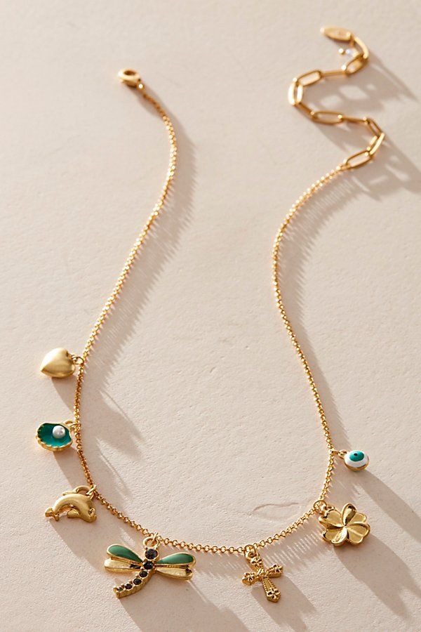 So cute and classic, this fun and funky charm necklace is featured in a 14k gold-plated design with sweet dangly detailing throughout for an added special touch. **Features:** Adjustable fit, charm style, dangle charm detailing, 14k gold-plated metal **Why We ❤ It:** Lovely for layering up or styling solo, this stand-out charm necklace is sure to be a staple in your necklace collection for countless years to come. | Only For Me 14k Gold Plated Charm by Free People in Gold Gold Charm Necklace Aesthetic, Diy Charm Necklace, Kathryn Core, Charm Necklace Ideas, Jewelry Mood Board, Charm Bar, Free People Jewelry, Trending Necklaces, Style Moodboard