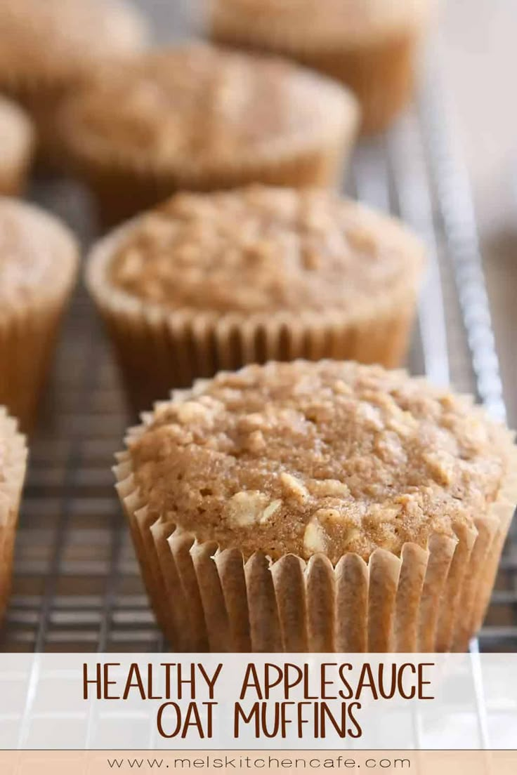 healthy applesauce oat muffins on a cooling rack with text overlay