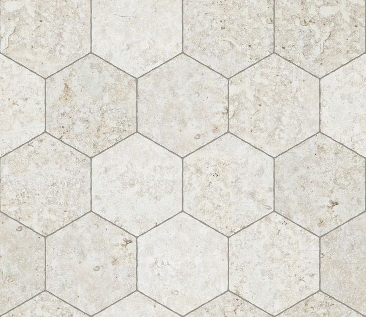 a white tile floor with hexagonal pattern