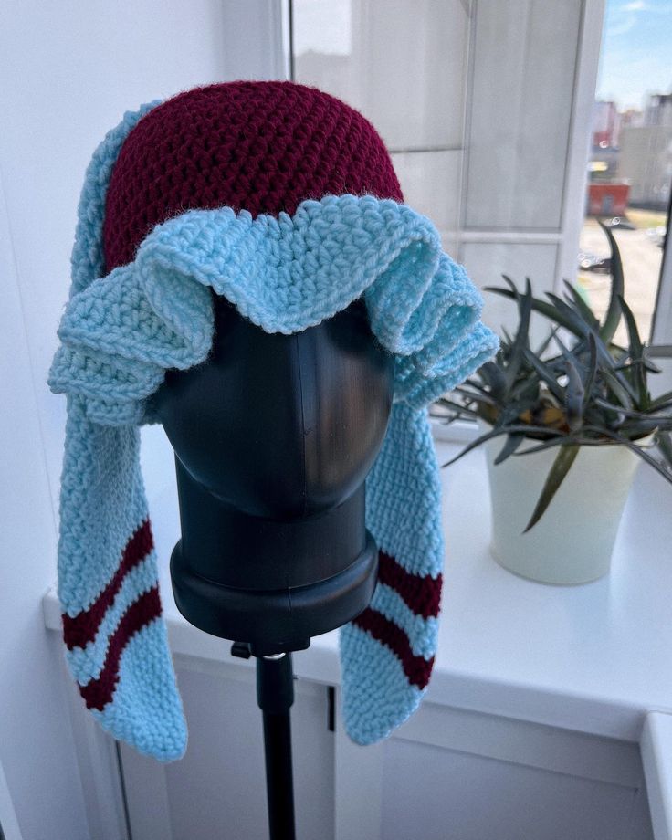 a crocheted hat on top of a mannequin head