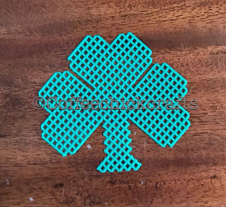 a wooden table topped with blue plastic shamrocks