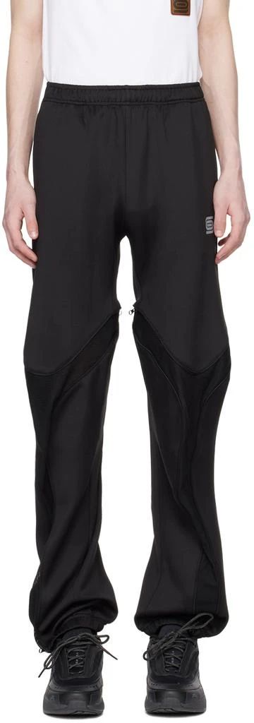 Olly Shinder.SSENSE Exclusive Black Tri-Zip Sweatpants.Polyester jersey sweatpants..· Concealed drawstring at elasticized waistband.· Two-pocket styling.· Logo printed at front.· Zip mesh expansion panel at legs.· Elasticized cuffs.Available exclusively at SSENSE..Supplier color: Black.Body: 100% polyester. Trim: 100% polyester..Made in United Kingdom..241077M190000 Athleisure Sports Bottoms With Zipper Closure, Sporty Nylon Bottoms With Zipper Closure, Sporty Streetwear Pants With Zipper Closure, Sports Pants With Zip Fly In Black, Black Sporty Pants With Zip Fly, Sporty Black Pants With Zip Fly, Sporty Black Bottoms With Zipper Closure, Sporty Pants With Zip Fly For Sports, Clothing Pants