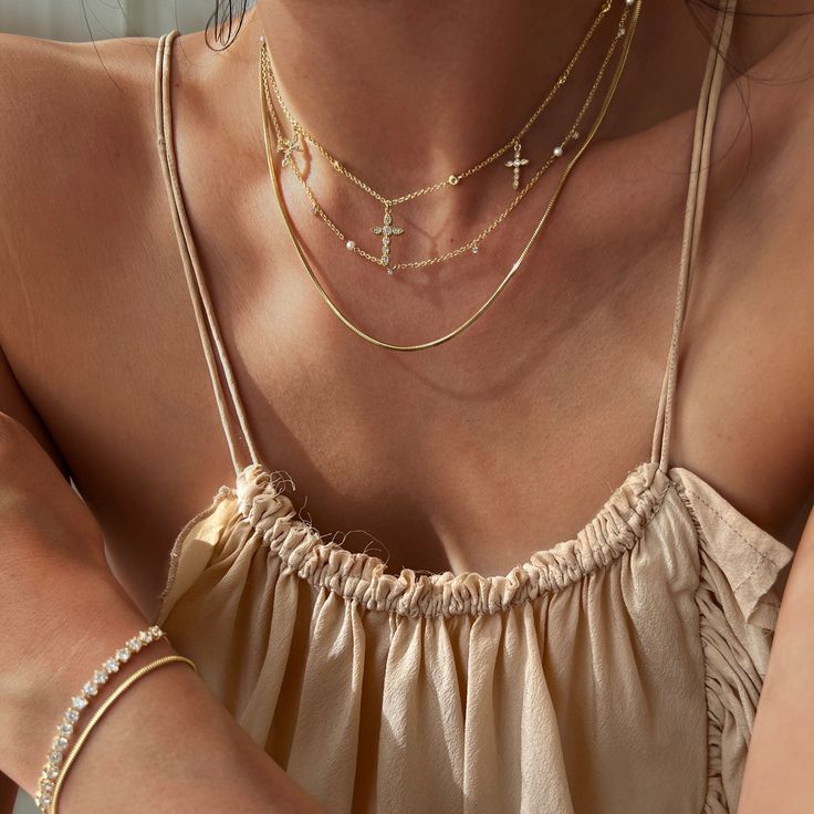 Perfect for both day and night, this necklace is sure to turn heads. Henio's rounded snake chain design, simple and femimine in style, will add shine as a statement on its own or be layered for endless glimmer. Check out the matching Taysom bracelet and Tejano anklet. Created with a sterling silver base and utilizing luxurious 14 karat gold plating, this Adorn Luxe necklace is everything you love about our demi-fine jewelry collection. Dainty Snake Chain Necklace For Party, Gold Clavicle Chain Charm Necklace With Snake Chain, Clavicle Charm Necklace With Snake Chain, Double Chain Snake Necklace For Layering, Snake Chain Necklace With Double Chain For Layering, Elegant Layered Snake Chain Necklace With Adjustable Chain, Gold Snake Chain Layered Necklace, Delicate Snake Chain Jewelry For Layering, Delicate Snake Chain Necklace For Layering