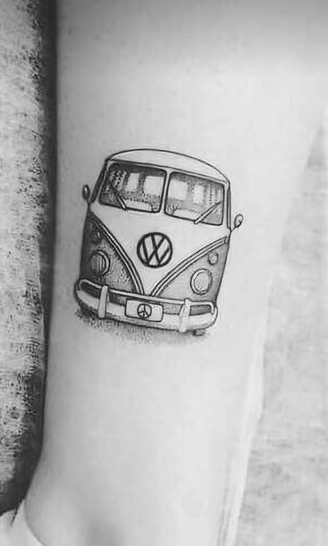 a black and white photo of a vw bus tattoo