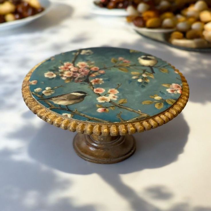 a table topped with plates and bowls filled with food on top of it's sides