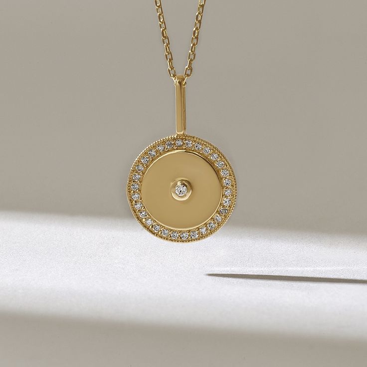 Minimalist Medallion Pendant Necklace for Women Features * Made to Order. * Gold KT: 14KT * Custom Gold Color: Yellow Gold * Charm 21.19mm x 13.72mm * Charm Thickness: 1.03mm * Diamond Color-Clarity: D-E-F color VVS clarity (excellent ideal cut) * Total Ctw: 0.32 ctw * Ready to Ship in 5-7 Business Days ✓ We care about the environment,the jewelry we cast is made with recycled gold. We source exclusively post-consumer material that is refined back to their pure elements to ensure that the gold is Women Circle, Pendant Necklace Diamond, Minimalist Pendant, Necklace Diamond, Medallion Necklace, Disc Pendant, Charm Pendant Necklace, Gold Necklace Layered, Necklace Unique