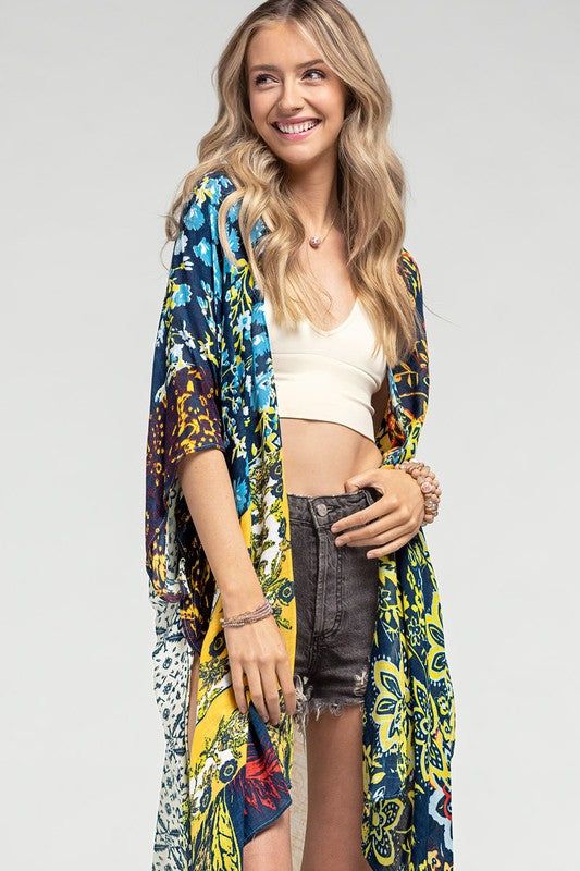 The colors on this kimono are just goregous! This will work with so much in your wardrobe! - 100% Viscose - 37.5"x39" - One size fits all Multicolor Printed Wrap Cover-up, Multicolor Print Kimono For Spring Beach Cover-up, Multicolor V-neck Kimono For Fall, Summer V-neck Beach Cover-up Outerwear, Trendy Blue Summer Outerwear, Multicolor Flowy Wrap Cover-up, Multicolor Wrap Kimono For Festivals, Multicolor V-neck Kimono For Beach Season, Multicolor Printed Cover-up With Kimono Sleeves