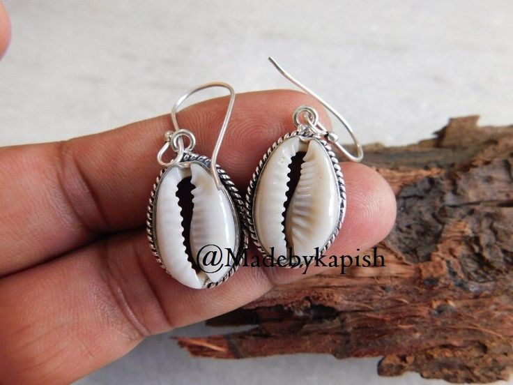 925 sterling silver Cowrie shells earring* Money cowrie shell Earrings* Cowrie Seashell Jewelry* earring for women* dangle earring* dangle* Earring length approx : 42 mm Cowrie size approx : 18 X 12 mm Metal - 925 sterling silver Weight of Earring : 6.24 Gm Metaphysical Properties of Cowrie : Minimalist in style but with a casual, beachy feel these natural cowrie shells have been suspended from sterling silver hooks. Lightweight and simple they are perfect for adding a touch of the beach to your Nickel-free Shell Gift, Summer Sterling Silver Jewelry With Matching Earrings, Sterling Silver Jewelry With Matching Earrings For Summer, Handmade Silver Shell Drop Earrings, Silver Shell Jewelry For Crafting, Silver Shell Dangle Earrings, Handmade Silver Dangle Shell, Silver Shell Jewelry For Jewelry Making, Bohemian Silver Shell Earrings