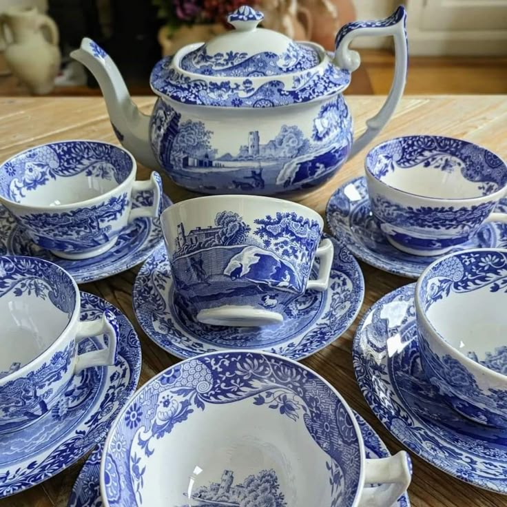 blue and white porcelain tea set on wooden table