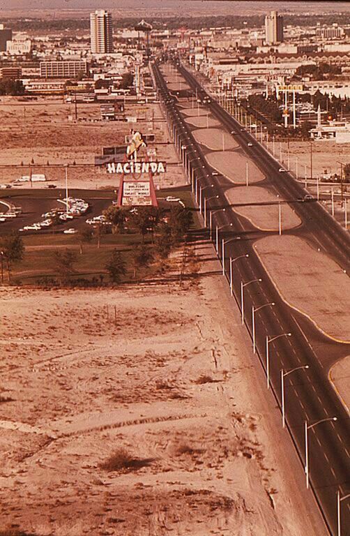 an aerial view of a highway in the desert