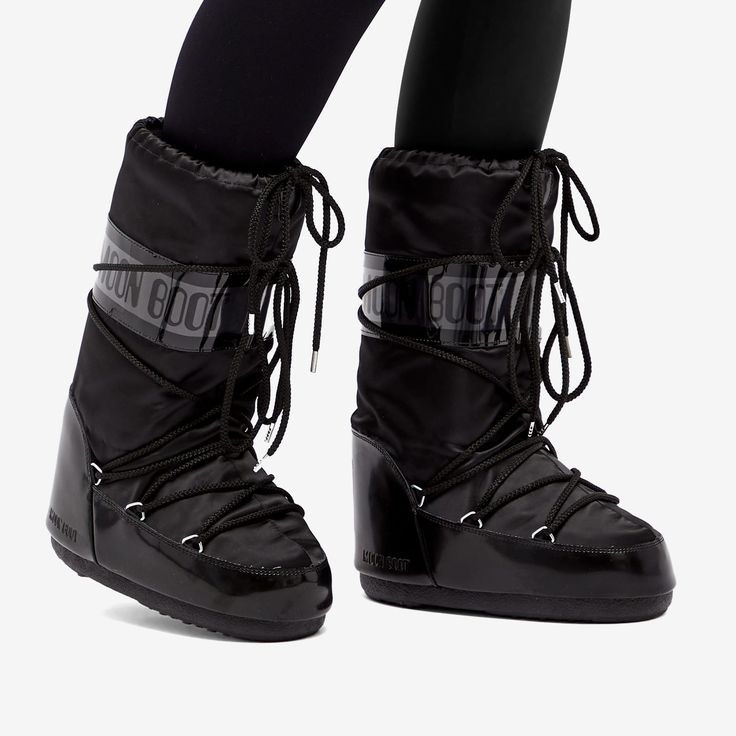 "Find MOON BOOT Icon Glance Boots on Editorialist. Moon Boot has been floating around since 1969. Let's give a big shout out to the moon-walking astronauts for their \"one small step for man, one giant leap for mankind\", the moment that sparked the genius in Giancarlo Zanatta to kick off the brand. This shiny satin edition stays true to the original's spirit, loaded with all the features to keep your feet protected - think water resistance, insulation, a feather-light midsole, and rubber soles with suction pads for some serious grip power. Satin Uppers, Water Repellent, PVC Heel Counter & Trim, Decorative Criss Cross Tubular Laces, Thermoplastic Midsole, Multisize Foam Lining, Rubber Tread Outsole. Moon Boot Women's Icon Glance Boots in Black, Size UK 2.5 - UK 5" Black Moon Boots, Moon Boots Black, Moon Boot Black, Moon Walking, Moon Clothing, Moon Boot, One Small Step, Small Step, Black Moon