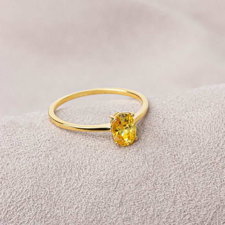 Our yellow topaz ring has a stylish design and is suitable for daily use. A nice gift that can make you and your loved ones happy. Yellow Topaz is one of the strong and  healing stones. F E A T U R E S * Made to Order. * Gold KT: 14K * Gold Color: Yellow Gold, Rose Gold, White Gold * Yellow Topaz Carat: 0.70 ct. * Stone Height: 7,00 mm / 0.28 inch * Stone Width: 5,00 mm / 0.20 inch * Setting Type: Bezel Setting * Ready to Ship in 1-3 Business Days * 100% US sourced * 2 Years Warranty * Free Express International Shipping * Free returns within 14 days from the order date Oval Cut 14K Solid Gold Yellow Topaz Ring, Mother's Day Gift, 14K Gold Birthstone Ring, Oval Cut  Ring, Women's Jewelry, Minimalist Ring We loved making our jewelry with special designs for your special moments. Wishing you Yellow Topaz Ring For Women, Yellow Topaz Ring Designs, Gift Yellow Gold Topaz Ring With Cubic Zirconia, Yellow Gold Topaz Birthstone Ring For Gift, Yellow Gold Topaz Ring With Cubic Zirconia For Gift, Yellow Gold Topaz Birthstone Ring As Gift, Yellow Topaz Promise Ring In 14k Gold, Elegant Yellow Solitaire Birthstone Ring, Yellow Crystal Birthstone Ring For Promise