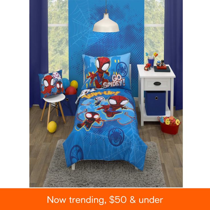 a bed room with a spiderman comforter and pillows