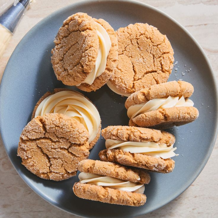 some cookies are on a plate with icing