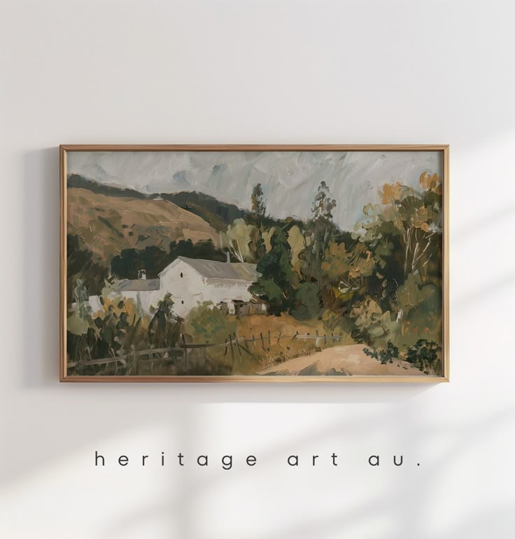 a painting hanging on the wall above a wooden frame with words heritage art au written below it