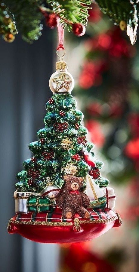 a christmas tree ornament with a teddy bear on it