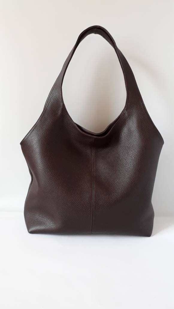 "This hand bag is crafted from textured soft leather in brown . It's the ideal size for taking you from desk to dinner, and can be worn over the shoulder for hands-free. - Two shoulder straps. - Pleated top with magnetic fastening. - You can choose from 8 leather colors. - Cotton lining with zip close compartment for securing your necessities, you can choose from 7 different linings. Free delivery is economic delivery. We use Latvian post and delivery can take 1-3 weeks in the EU, 3-4 weeks ever Brown Textured Leather Hobo Bag With Double Handles, Elegant Brown Hobo Bag, Leather Hobo Bag With Rolled Handles, Brown Leather Bucket Bag With Rolled Handles, Brown Textured Leather Hobo Tote Bag, Brown Hobo Bag For Shopping, Brown Textured Faux Leather Shoulder Bag, Brown Hobo Bag With Soft Leather And Double Handle, Brown Soft Leather Hobo Bag With Double Handle