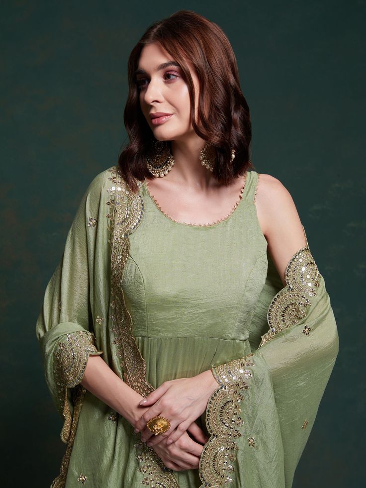 Introducing our amazing sea green georgette mehendi wear gown with a heavy dupatta! This beautiful green gown is perfect for all your festive occasions, from Mehendi ceremonies to festivals and special events. The gown is made of high-quality georgette fabric and comes fully stitched in sizes ranging from XS to XXL, ensuring a perfect fit for everyone.
This stunning gown includes a similar color georgette dupatta with intricate sequin work, thread embroidery, and designer lace work. This adds a Green Floor-length Kurta For Reception, Floor-length Green Kurta With Gota Work, Green Floor-length Kurta With Gota Work, Green Maxi Length Designer Traditional Wear, Green Georgette Gown With Cutdana Detail, Pista Green Georgette Anarkali Set For Navratri, Green Semi-stitched Gown With Cutdana, Green Anarkali Set For Reception, Green Zari Work Anarkali Set Maxi Length