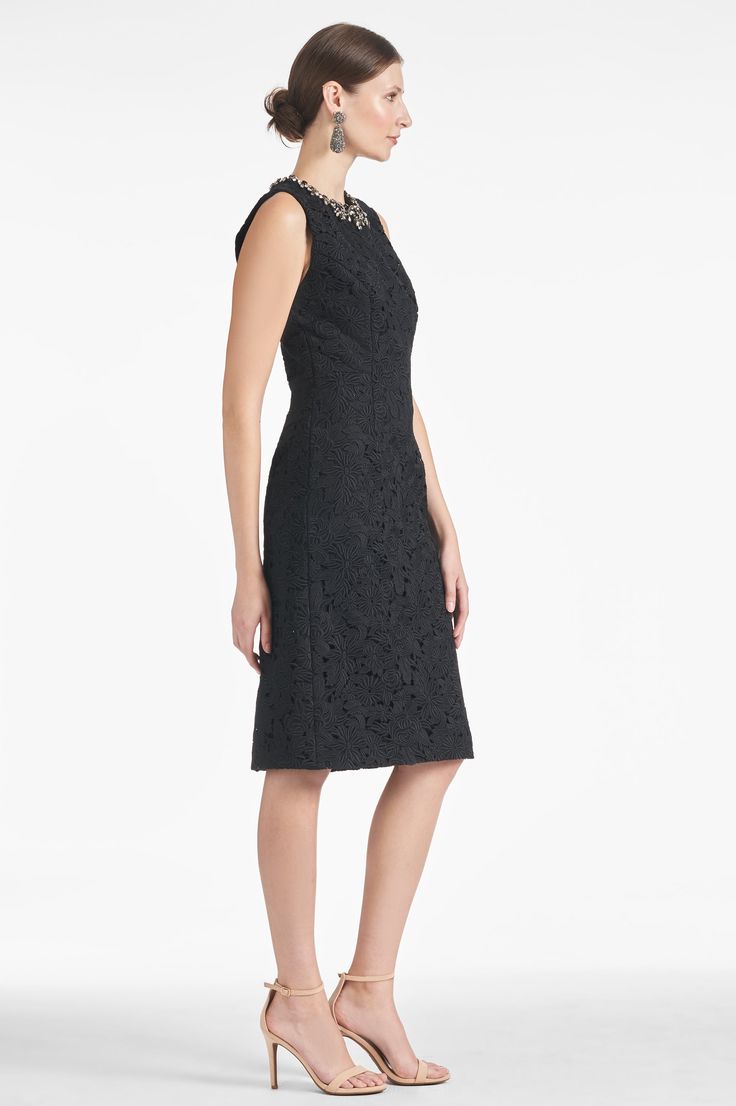 The Anna Dress - Noir is the perfect combination of timeless elegance and feminine grace. With its embellished neckline and lace body, the dress is the perfect length, color, and silhouette for any special occasion. Details:Model is 5'10" wearing size 242" Long Back Zipper Thick Lace100% Polyester ImportedStyle #F231D08-001 Formal Midi Dress With Lace Bodice, Elegant Midi Dress With Lace Bodice, Formal Lace Dress With Fitted Bodice And Midi Length, Chic Formal Midi Dress With Lace Bodice, Elegant Lace Midi-length Mother Of The Bride Dress, Formal Midi Dress With Lace Trim And Fitted Bodice, Cocktail Dress With Scalloped Lace And Fitted Bodice, Elegant Lace Midi Dress With Fitted Bodice, Sleeveless Scalloped Lace Gala Dresses