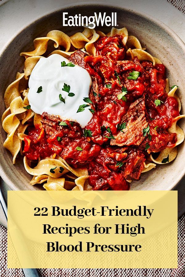 a bowl filled with pasta and sauce on top of a table