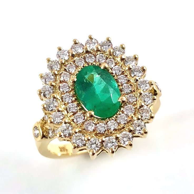 Emerald oval and diamond yellow gold ring Size 7.5 US - Ready to ship or Resize This is Emerald oval brilliant cut 0.97 carat gemstone measuring approximately 8.22x5.75x3.56mm flanked by a multitude of diamonds and set in 14k yellow gold ring. I provide a layaway payment plan just ask me. Ring Specifications: * 0.97 carat Emerald, oval cut * 54 Melee sized diamonds totalling 1.38 carats (31 x 1.5mm diamonds and 23 x 2mm diamonds). VS clarity, G-H color. * 14k yellow gold set ring * Ring size 7.5 Oval Yellow Gold Halo Ring Gia Certified, Gia Certified Oval Emerald Ring In Yellow Gold, Oval Halo Ring Stamped 14k Fine Jewelry, Oval Stamped 14k Halo Ring Fine Jewelry, Gia Certified Oval Diamond Ring In 14k Gold, Oval Emerald Ring In Yellow Gold With Halo Setting, Luxury Oval Cluster Ring Stamped 14k, Luxury Stamped 14k Oval Cluster Ring, Gold Oval Emerald Ring With Vvs Clarity