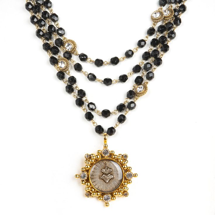 Designed over two decades ago and born from a rosary, the Magdalena necklace is a force of strength and creativity. There’s a reason that some of the most creative people in the music industry, including celebrities and Grammy-award winning pop stars, have worn and carried this powerful Virgins Saints & Angels necklace. Handmade in Mexico, this divine piece is assembled with jet black Austrian crystal beads and can be paired with any of our detailed Luxury Medallions including the Cloister Sacre Burgundy Earrings, Maria Magdalena, Angel Necklace, Gold Medallion, Catholic Jewelry, A Force, Jewelry Cleaner, Faceted Crystal, Stunning Jewellery