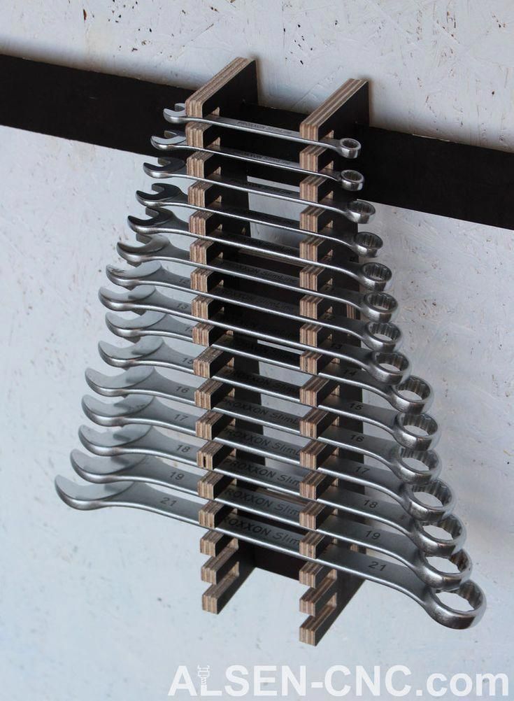 there is a rack that has many pairs of scissors hanging from it's sides