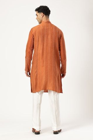 Rust brown chanderi silk kurta featuring horizontal stitch embroidery and geometric georgette fabric applique on the chest and sleeves, Fit: Relaxed Traditional Brown Kurta For Eid, Brown Traditional Drape Kurta For Eid, Straight Chanderi Kurta With Woven Motifs, Brown Straight Kurta For Diwali, Chanderi Straight Kurta With Woven Motifs, Festive Brown Kurta With Chikankari Embroidery, Brown Chikankari Embroidery Kurta For Eid, Festive Brown Chanderi Kurta, Brown Kurta With Resham Embroidery In Traditional Drape