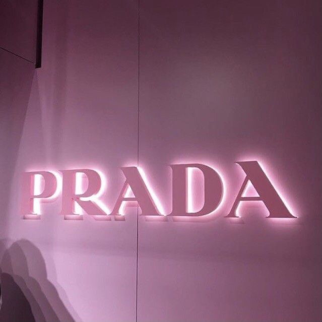 the word prada is lit up in pink