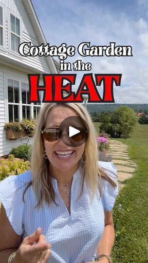 a woman sitting in front of a house with the caption cottage garden in the heat