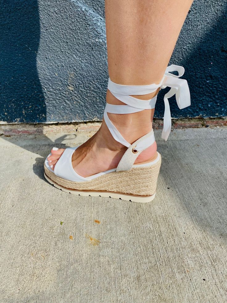 Step into style with our Ankle Lace Up Espadrille Wedge Sandals! These unique and playful shoes feature a lace up ankle design, combining fashion and function. The espadrille wrapped wedge adds a touch of quirkiness to any outfit. Say goodbye to boring, basic sandals and step up your shoe game with these fun and fashionable wedges! Adjustable Platform Lace-up Sandals, Adjustable Platform Espadrilles For Spring, Casual Lace-up Wedge Sandals For Spring, Lace-up Espadrille Platform Wedge Sandals, Adjustable Platform Lace-up Sandals For Spring, Spring Adjustable Wedge Heel Sandals, Adjustable Lace-up Wedge Sandals For Spring, Spring Lace-up Adjustable Wedge Sandals, Lace-up Platform Wedge Sandals