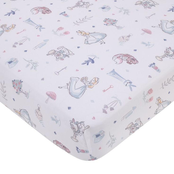 a white sheet with cartoon characters on it and pink trimmings, sitting on top of a bed