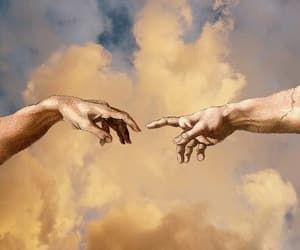 two hands reaching out towards each other in front of a cloudy sky with white clouds