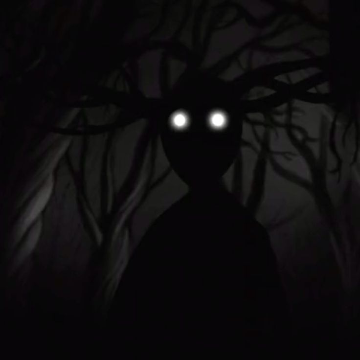 a creepy looking person with glowing eyes in the dark